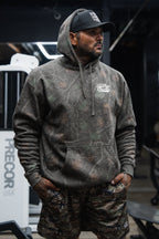 Lift Heavy. Trust God. - Premium Darkwood Camo Hoodie